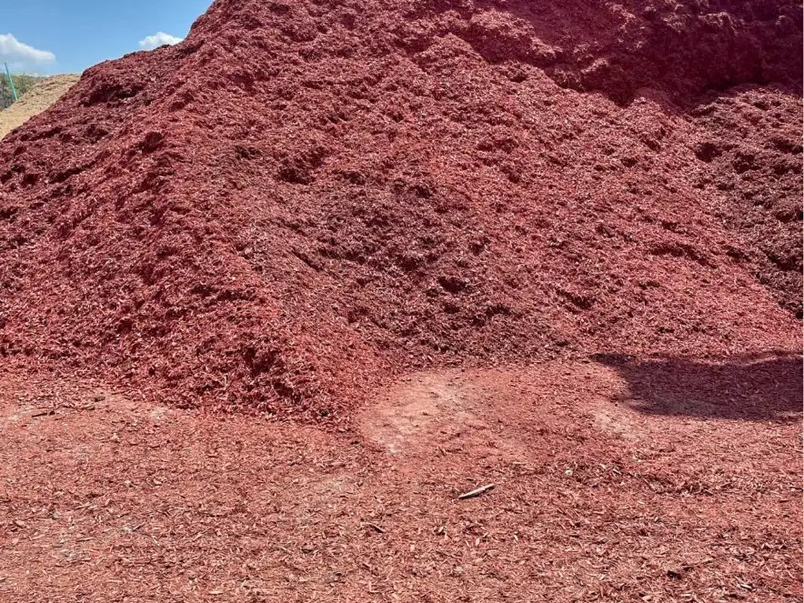 Large pile of red-brown bulk mulch